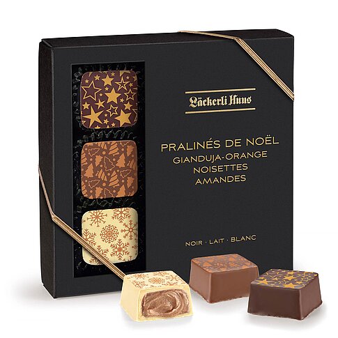 Verpackung mit Sichtfenster und goldener Kordel